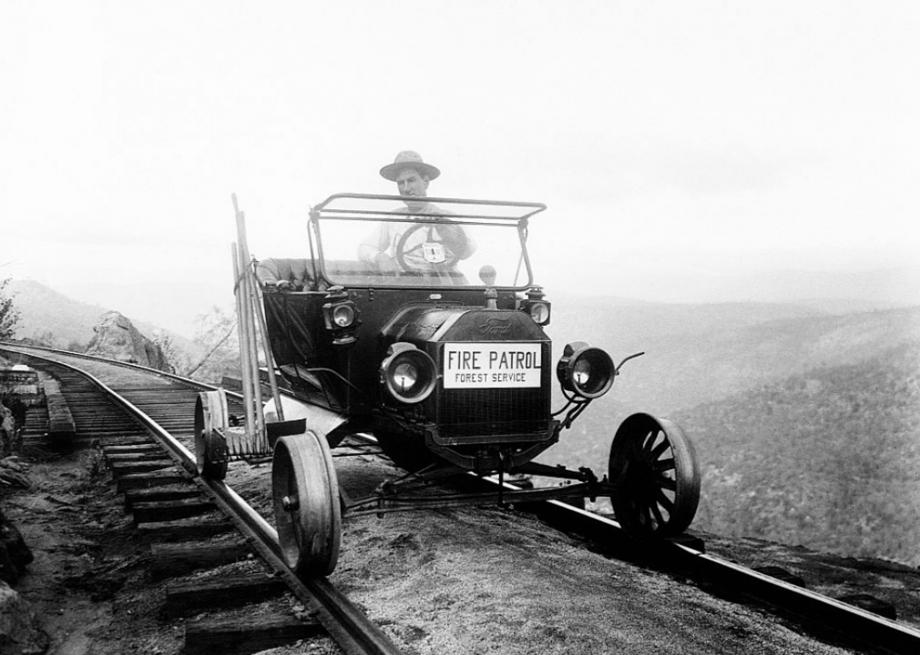 Ranger driving car on railroad